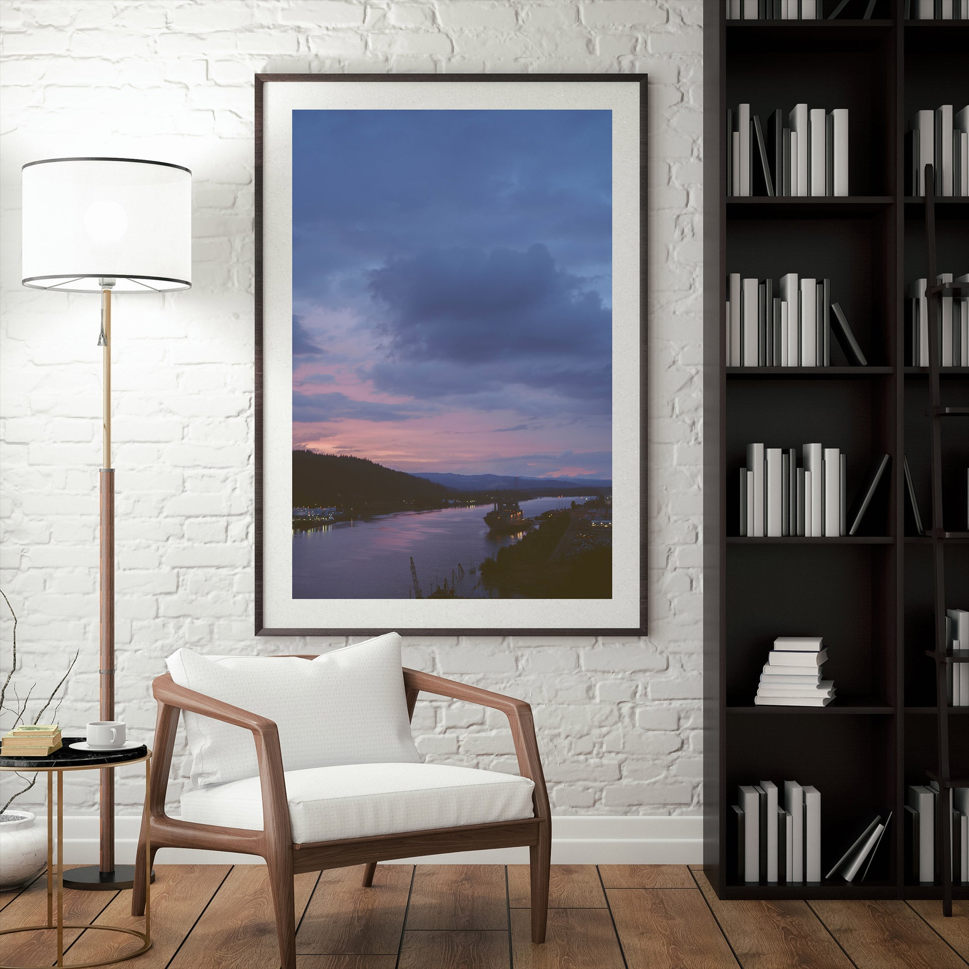 a framed photograph of a lovely sunset on the willamette river in portland oregon. a large ship sits on the water