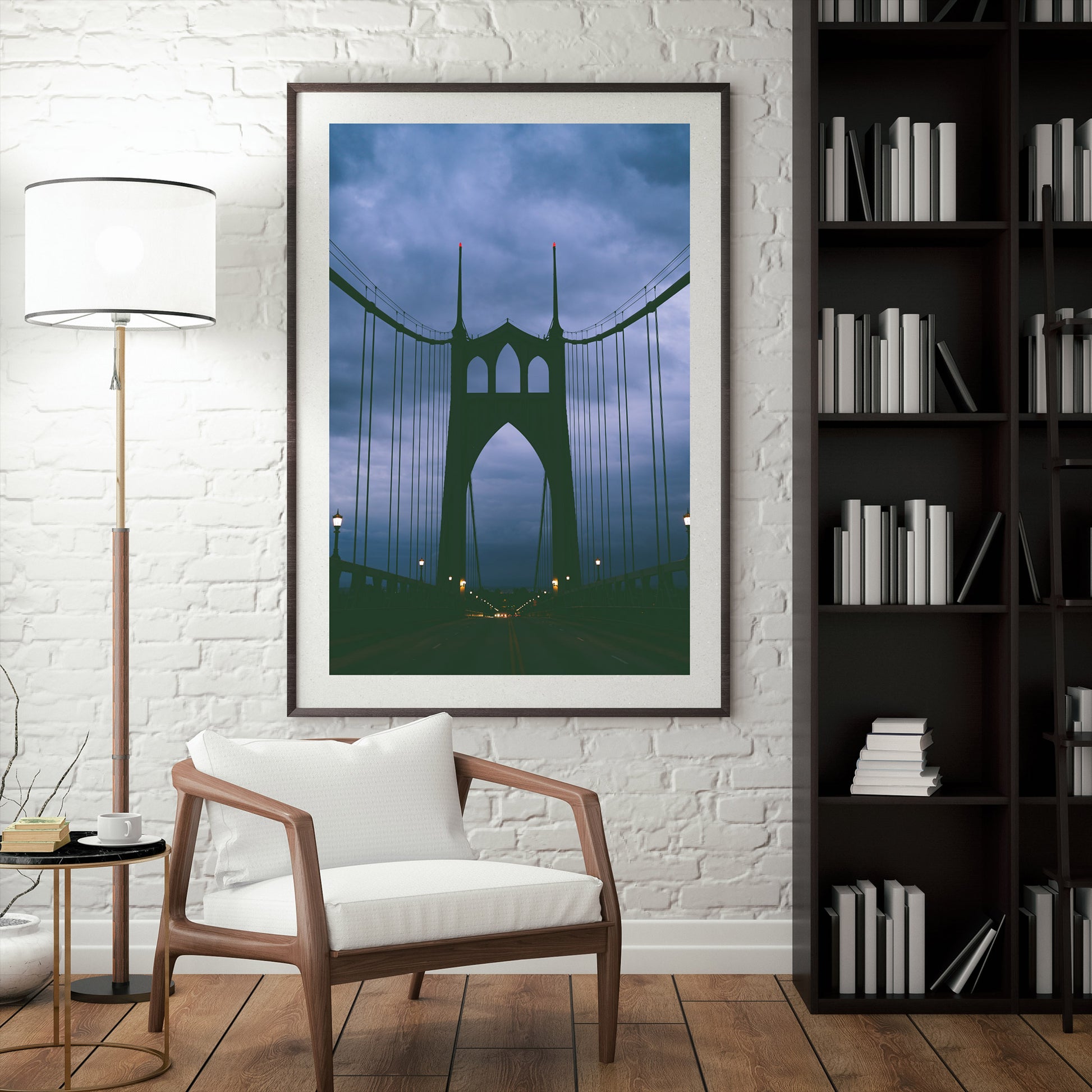 a mock up of a framed photograph of the st johns bridge in the evening with stormy blue clouds behind it.