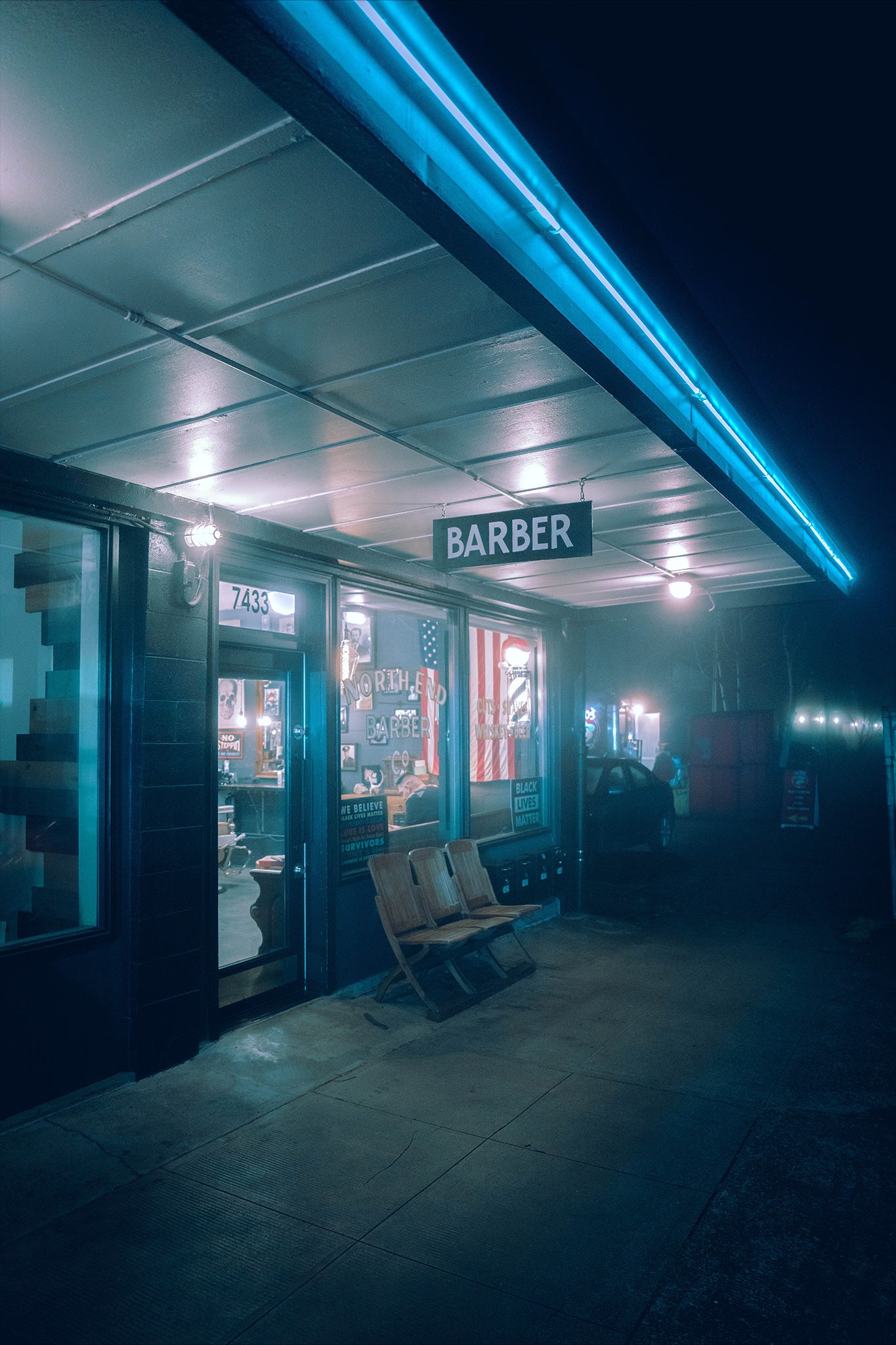 a barber shop in the neighborhood of st johns in portland on a foggy night